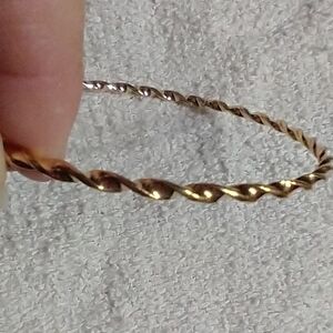 Goldtone twisted Bangle bracelet 2.75 i.d.